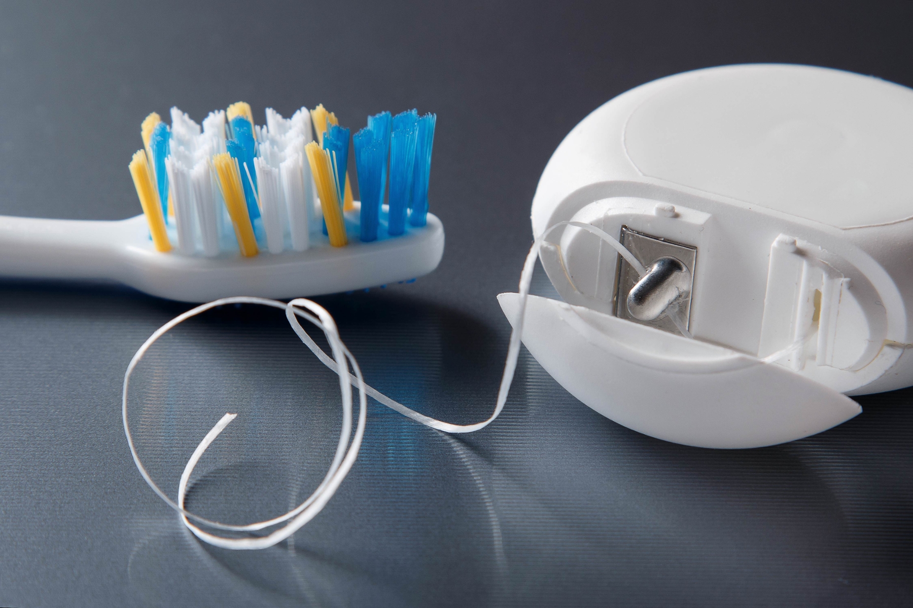 toothfloss and toothbrush | bellevue dental office