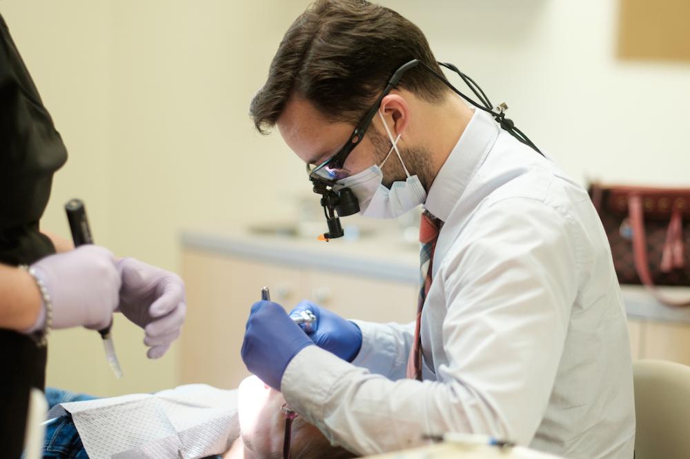 justin poff dds working on patient | full mouth reconstruction bellevue