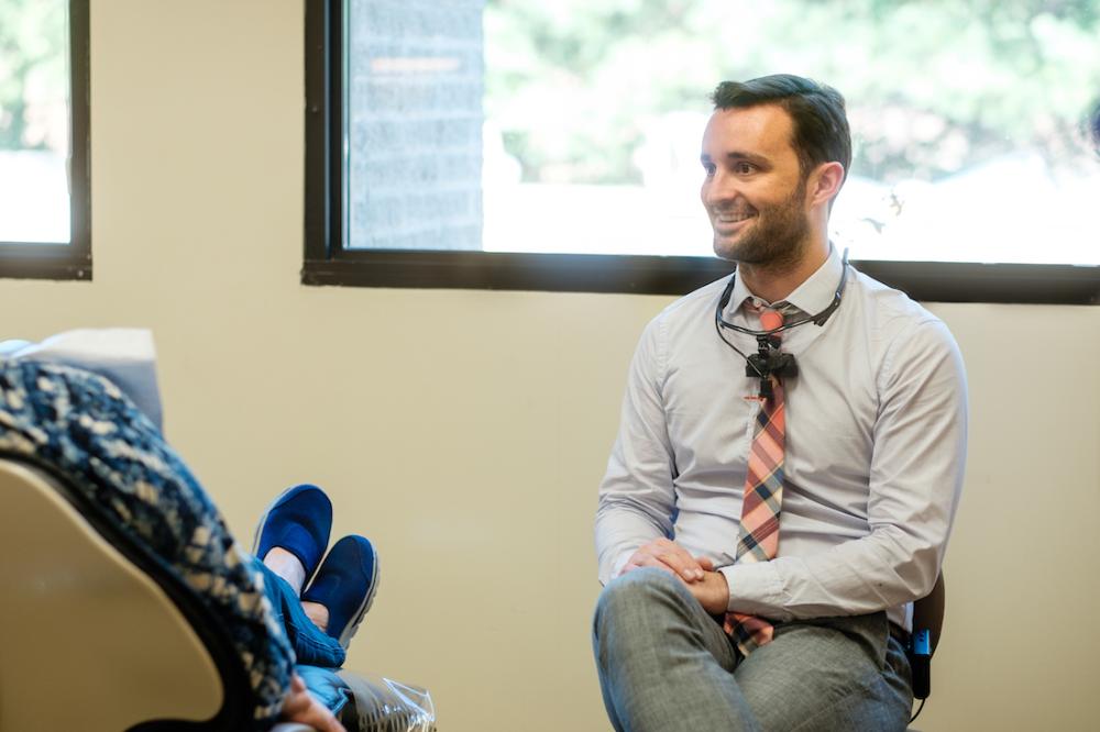 dr justin poff with patient | dental implants nashville tn