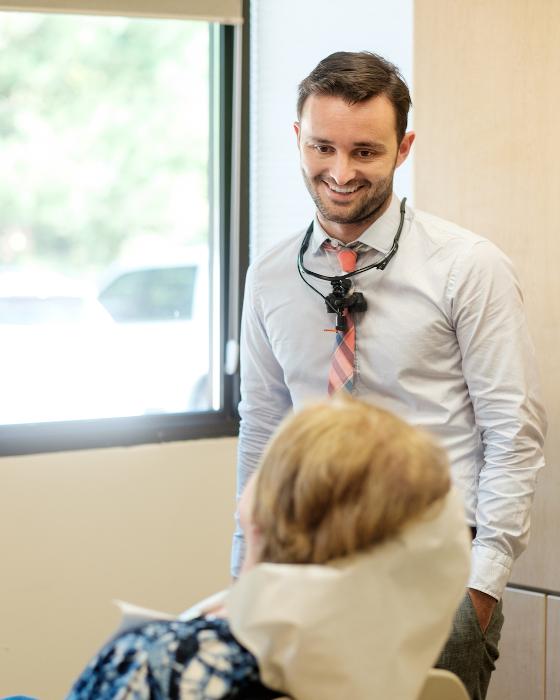 justin poff dds with patient | all on x implant dentures bellevue