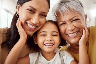 multi generational women hugging | dental implants bellevue tn