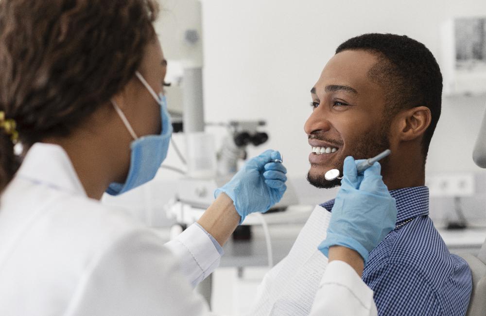 man receiving dentist exam | sedation dentist bellevue tn