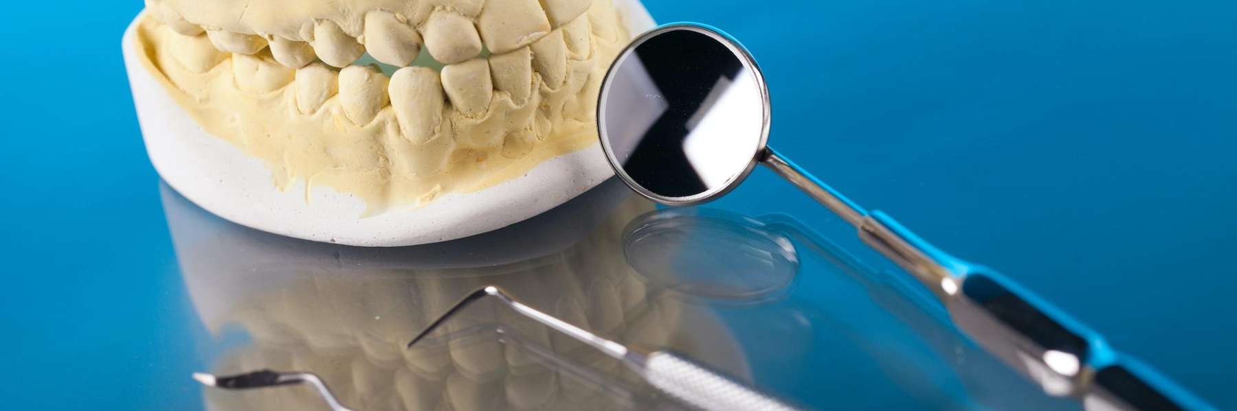 dental mouth mold with dental tool | dentist in bellevue tn