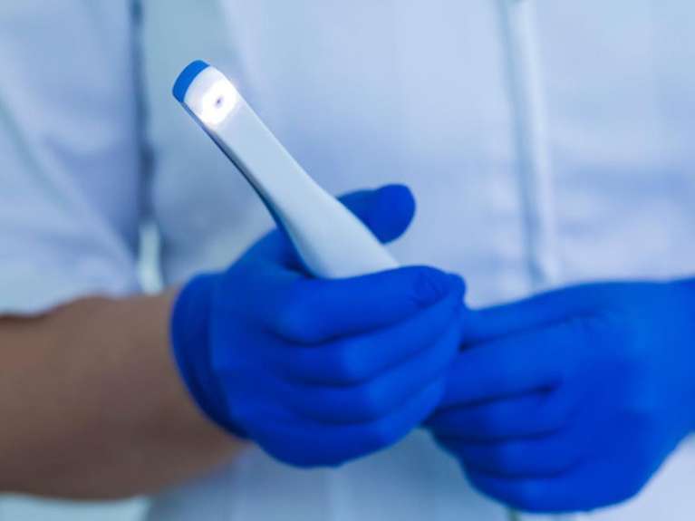 dentist holding intraoral camera technology | dentist office nashville tn
